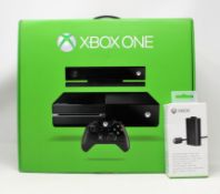 A pre-owned boxed 500GB Xbox One in black. Includes Kinect sensor, controller, cables and boxed