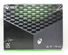 A boxed as new Xbox Series X (1TB SSD) games console in black (box damaged) (box opened to check