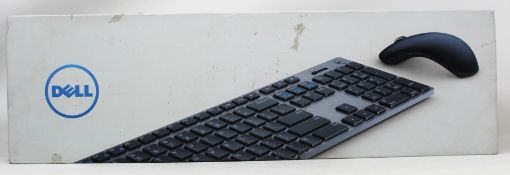 A boxed as new Dell premier multi-device bluetooth keyboard and mouse set. (box opened) (Damage to