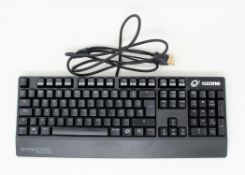A boxed Ozone StrikePro Spectra mechanical RGB keyboard with cherry red switches. (PLEASE NOTE