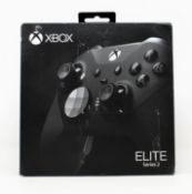 A boxed pre-owned xbox Elite series 2 contoller for Xbox and Windows in black/silver (damaged box)