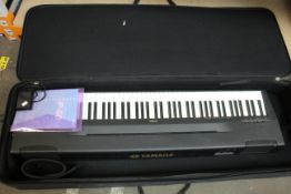 A pre-owned Yamaha P60 electronic keyboard (Comes with UK power supply, sustain pedal and a Stagg
