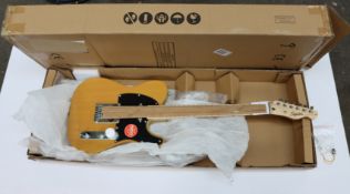 A boxed as new Fender Squier Affinity Telecaster MN (Butterscotch Blonde).