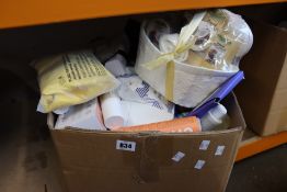 A box of assorted as new luxury beauty items to include teeth whitening, Glossier, Ted Baker and