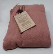 An as new Caravana Lan long vest in carmine red (One size - RRP £288).