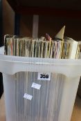 A box of assorted vinyls/records