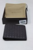 A boxed as new Bottega Veneta wallet in brown.