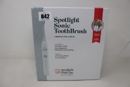 A boxed as new sealed Spotlight Sonic Toothbrush.