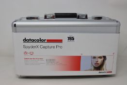 An as new Datacolor SpyderX Capture pro (contained in a metal carry case sealed and unopened).