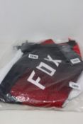 A pair of as new Fox 360-Youth Voke Motocross Pants in fluoro red (26).