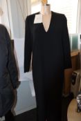 An as new Mark Kenly Domino Tan Demetra long V-neck dress with buttoning in black (Size 34).