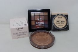 Twelve NYX professional Ultimate eye shadow palettes (16 pods per palette), three NYX professional