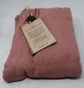 An as new Caravana Lan long vest in carmine red (One size - RRP £288).