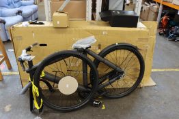 A Vanmoof S3 electric bicycle with toolbox.