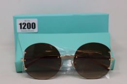 A pair of ladies boxed as new Tiffany & Co. Sunglasses (TF3071 60213B 56).