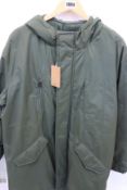 An as new A.P.C. Thom fishtail parka in kaki militaire (L - RRP £315).