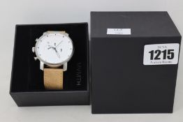 An as new boxed MVMT silver & white chronograph with date watch.