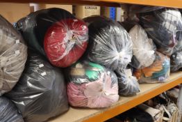 Twelve bags of clothing and related items.