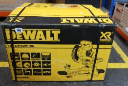 A boxed as new Dewalt XR Li-ion cordless sliding compound mitre saw (DCS365).