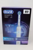 A boxed as new Oral-B Smart Series 5 (5000) Cross Action Rechargeable Toothbrush.
