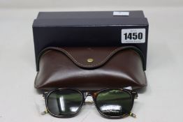 A pair of as new Ralph Lauren sunglasses.