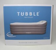 A boxed as new Tubble Royale inflatable bathtub.