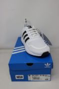 Two pairs of as new Adidas Multix trainers (UK 8, UK 9).