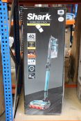 A boxed Shark cordless stick vacuum (IZ201UK).
