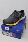 A pair of as new Mizuno Wave Rider 24 trainers (UK 8.5).