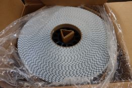 Four rolls of Sensormatic stick-on security tags (Approximately 7000 per roll).