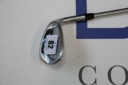 An as new Callaway Mack Daddy CB wedge gold club.