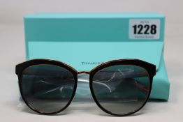 A pair of boxed as new Tiffany & Co 0TF4146 black/blue/gold 80553C - 56mm sunglasses.