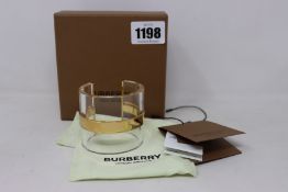 A boxed Burberry light gold/crystal cuff (size/fit M).