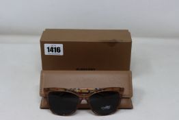 A pair of as new Burberry sunglasses.