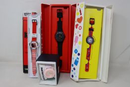 A Disney Keith Haring mickey mouse Swatch watch, a men's black Swatch watch (Slight mark on