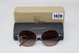 A pair of as new Burberry sunglasses.