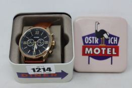 A Fossil men's Flynn chronograph black dial tan leather strap.