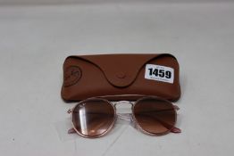 A pair of as new Ray Ban sunglasses.