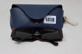 A pair of as new Loewe sunglasses.