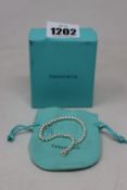 A Tiffany & Co Blue Enamel heart bracelet.