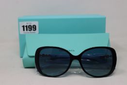 A pair of ladies boxed as new Tiffany & Co. Sunglasses (TF4121B 80559S 55).