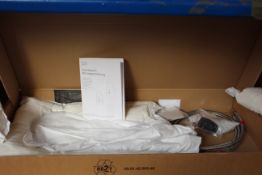 A boxed Dornbracht Sync Pull Out Kitchen Tap in Dark Platinum Matt (33875895-99).