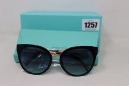 A pair of ladies boxed as new Tiffany & Co. Sunglasses (TF4168 80559S 54).