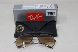 A pair of as new Ray Ban sunglasses.