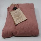 An as new Caravana Lan long vest in carmine red (One size - RRP £288).