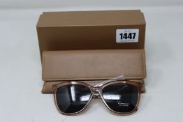 A pair of as new Burberry sunglasses.