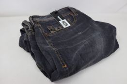 A pair of as new Diesel Sleenker-X jeans (W34/L32 - RRP £145).