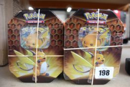 Four tins of as new Pokemon Hidden Fates Trading Card Games.