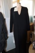 An as new Mark Kenly Domino Tan Demetra long V-neck dress with buttoning in black (Size 32).