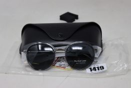 A pair of as new Ralph Lauren sunglasses.